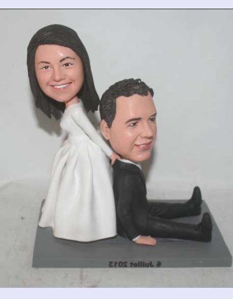 Bride dragging groom cake toppers