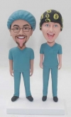 Custom doctor bobbleheads in scrubs and surgical cap
