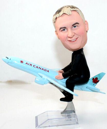 Custom bobbleheads sitting on airplane doll for father/boss  - Click Image to Close